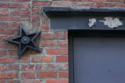 what do the metal stars on people's houses mean|metal stars on old buildings.